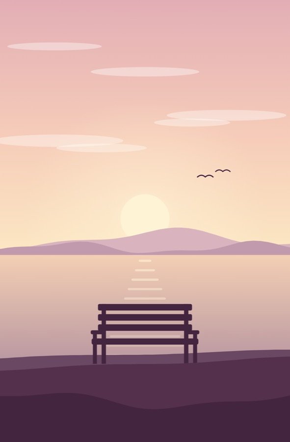 An empty bench facing a sunrise